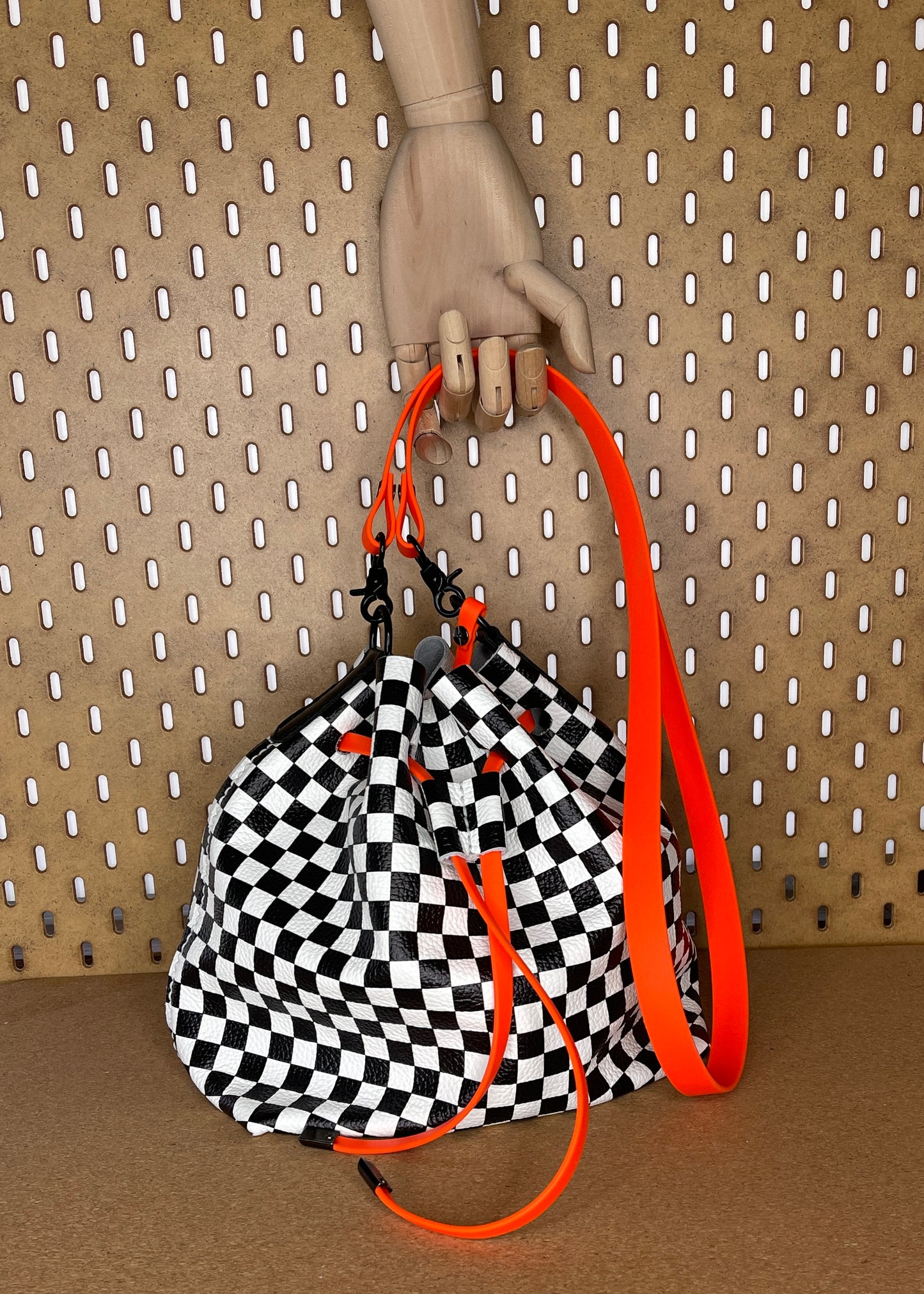 Checkerboard Leather and Neon Orange Drawstring Crossbody Bucket Bag
